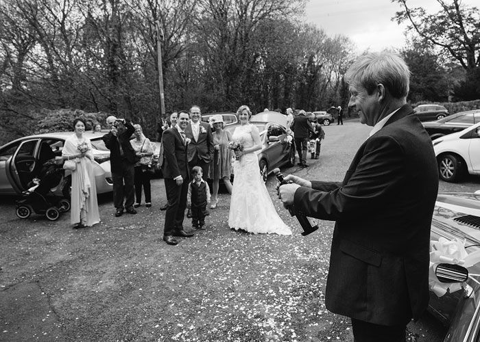 Bottle of champagne being opened at North Wales Wedding ceremony